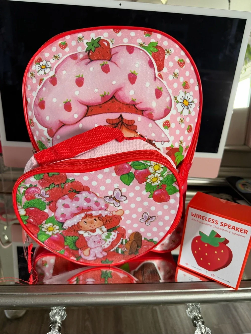 Pink Strawberry Kids Backpack with Lunchbox and a strawberry wireless speaker